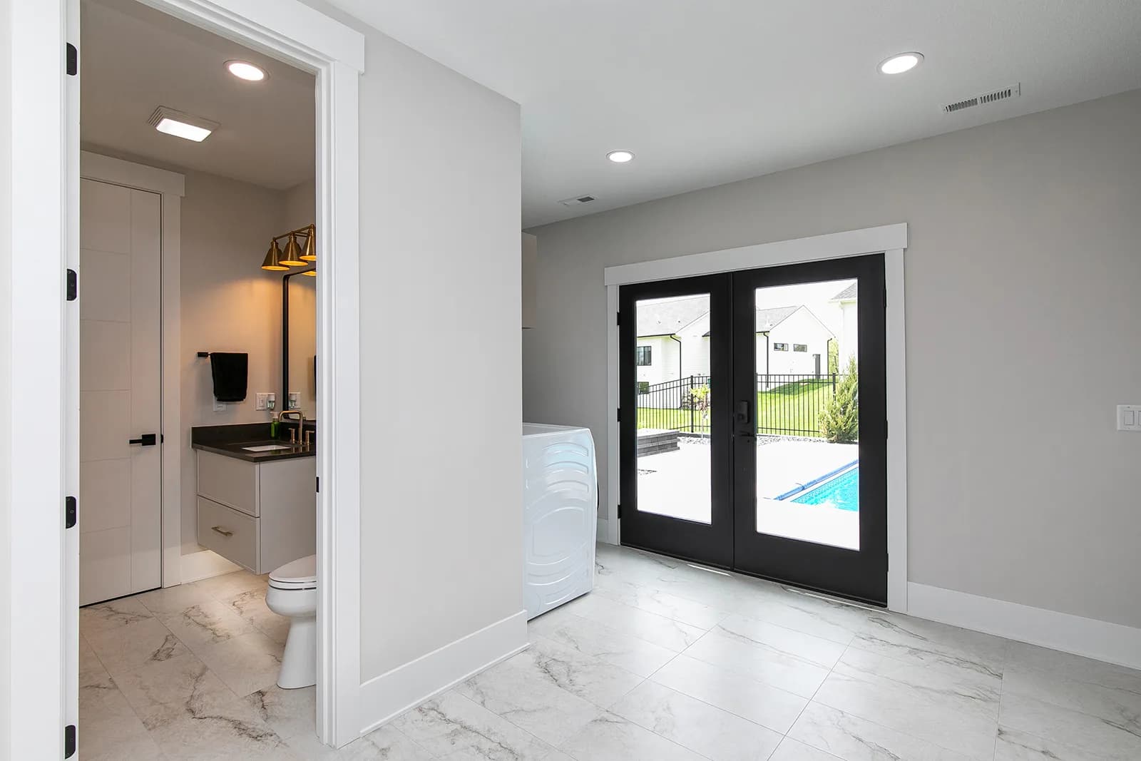 3856 NW 177th Ct — wet bar hallway to the pool