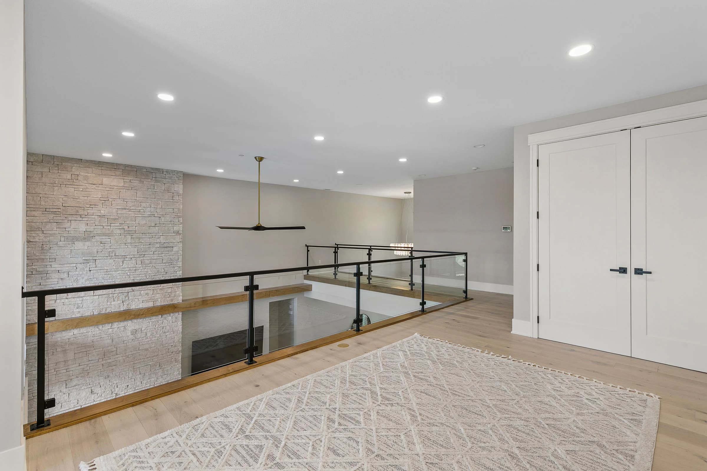 Forest Pointe — loft hallway with stone accent