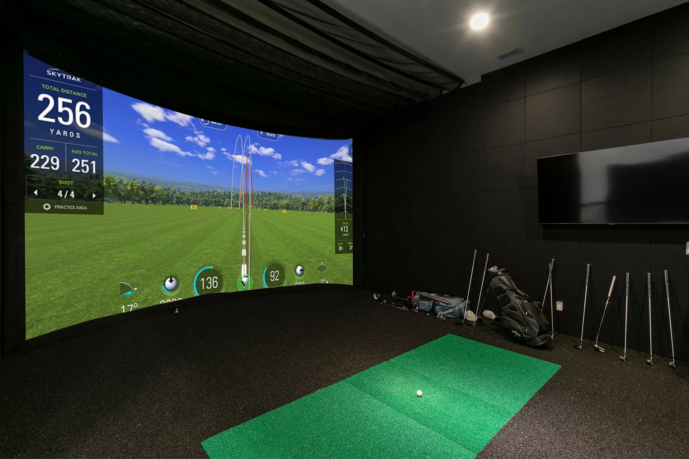Golf simulator room in a MIR Homes lower level